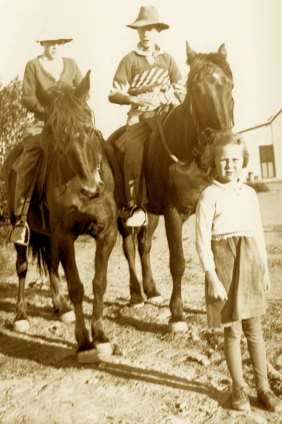 Jill Ker Conway, foreground, as a child with father, Barry, right on horse, and brother Bob, left.