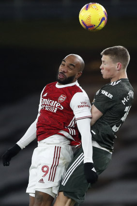 Alexandre Lacazette of Arsenal and Scott McTominay of Manchester United.
