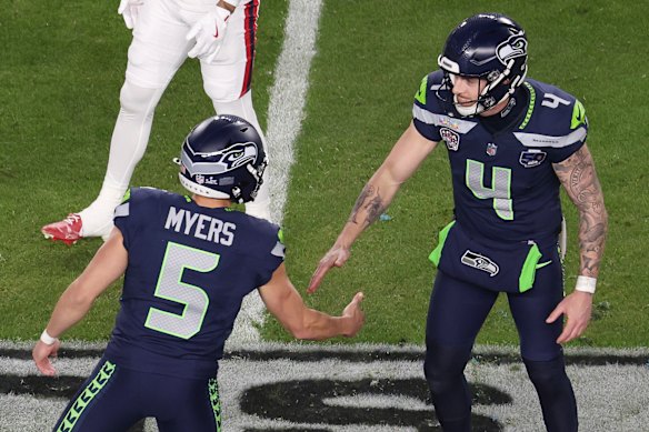 Michael Dickson celebrates with Seattle teammate Jason Myers.