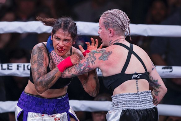 Alma Garcia, left, takes a hit from Bec Rawlings during a 125-pound bout at the Bare Knuckle Fighting Championship in 2018. Rawlings was due to fight in Perth as part of a planned bout at RAC Arena in July.