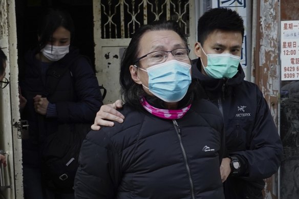 District councillor and lawyer Daniel Wong Kwok-tung, (centre), is escorted by police outside his office after police search in Hong Kong, on Thursday, January 14.