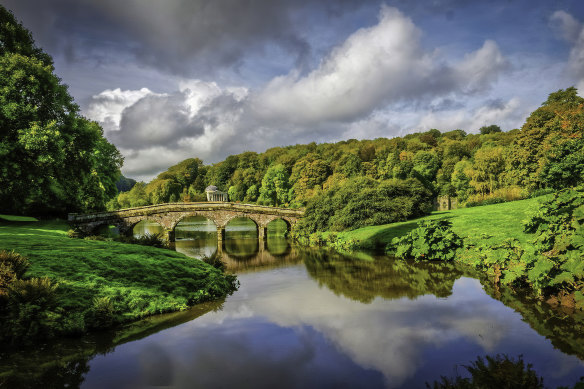 Bridge over the main lake in Stourhead Gardens, England.