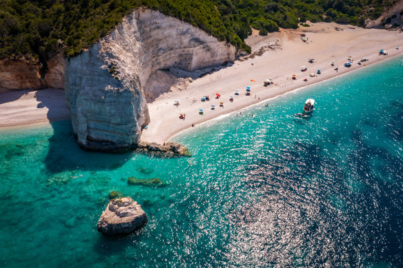 A beach on Kefalonia and the clear emerald blue Ionian Sea. 