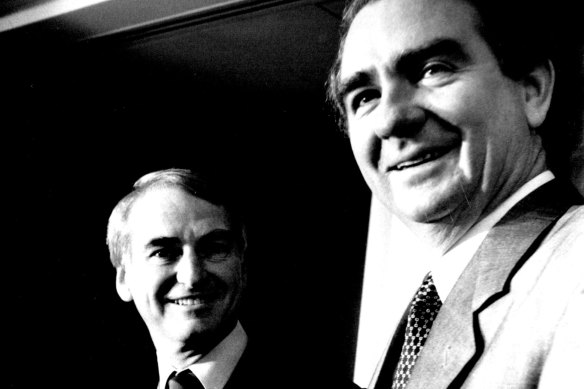 Tony Fitzgerald handing his report to then-Queensland premier Mike Ahern ahead of the parliamentary debate.