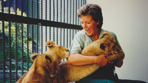 The author with African lion cub triplets Bruiser, Shinyanga and Njeri, in 2000. “Every day was different and exciting, even if the lunchroom was heavy with testosterone,” she says of her time at Taronga Zoo.