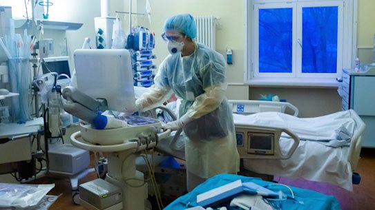 An intensive care nurse cares for a COVID-19 patient in the ICU of a Berlin hospital this week.