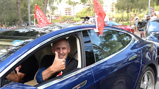 Former Greens leader Bob Brown leaves in a Tesla vehicle after attending an anti-Adani rally in Sydney.