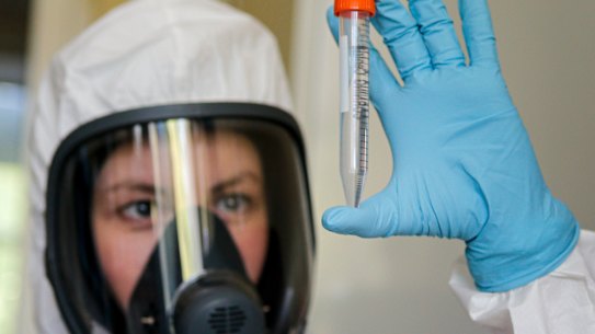 An employee shows the new vaccine at the Nikolai Gamaleya National Centre of Epidemiology and Microbiology in Moscow.