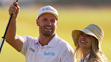 Wyndham Clark celebrates with his girlfriend Emily Tanner after winning the US Open at Shinnecock Hills Golf Club in Southampton, New York.