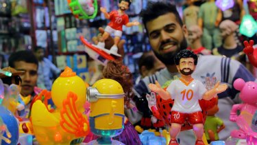Egyptians buy traditional Ramadan decoration items 'Fanous' depicting the Egyptian Liverpool soccer player Mohamed Salah at a market in Cairo.