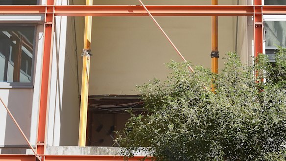Exposed wiring in the ceiling of one of the apartments in Zetland.