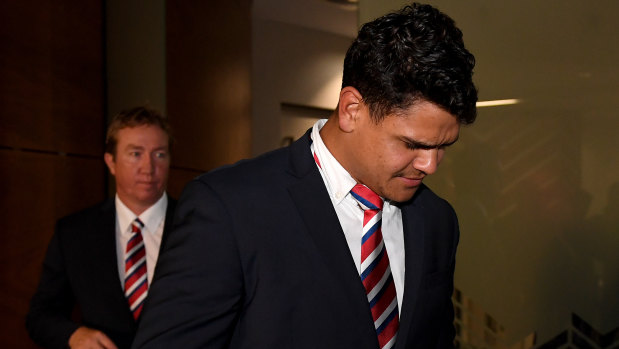 No comment: Latrell Mitchell and Trent Robinson leave the hearing on Tuesday  night.