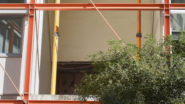 Exposed wiring in the ceiling of one of the apartments in Zetland.