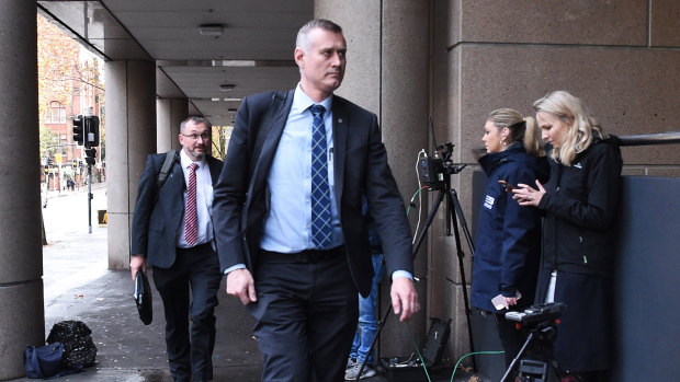 AFP officers arrive at the ABC offices, where they spent the afternoon sifting through thousands of documents related to an ABC investigation.