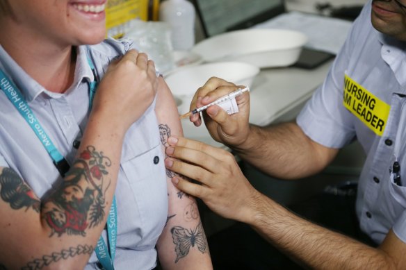 A health worker receives the Pfizer jab at the Princess Alexandra Hospital.