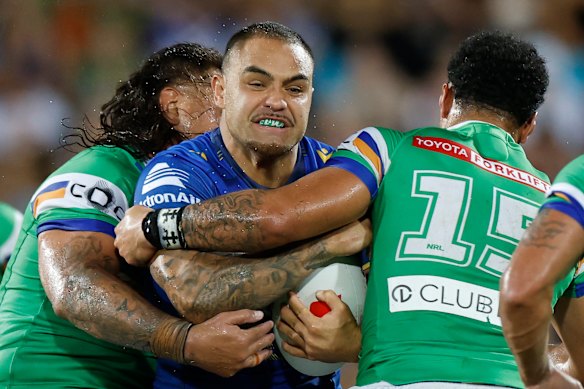 Dylan Walker of the Eels is tackled. 