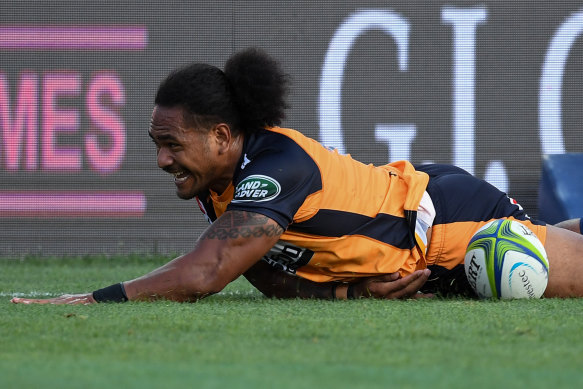 Brumbies winger Solomone Kata slides in for a try against the Chiefs.