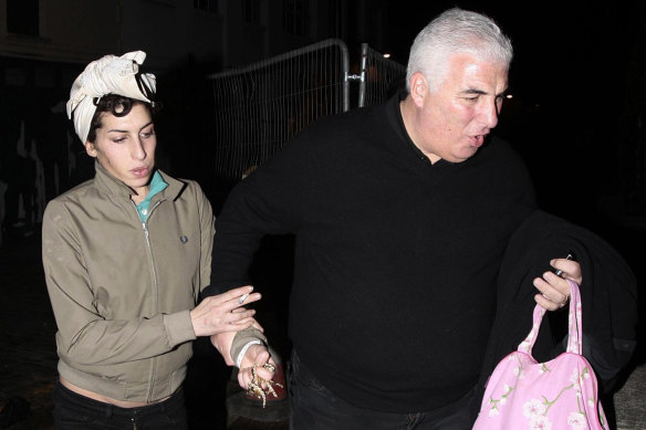 Winehouse with her father Mitch in 2008.