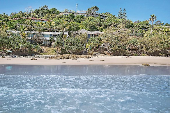 Lawyer Scott Stewart bought a three-bedroom beachfront shack  (pictured centre) for $3,735,000 in 2014, then knocked it down to make way for the stylish new trophy home.
