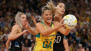 Gretel Tippett under pressure from Karin Burger in Australia's series-deciding win over New Zealand.