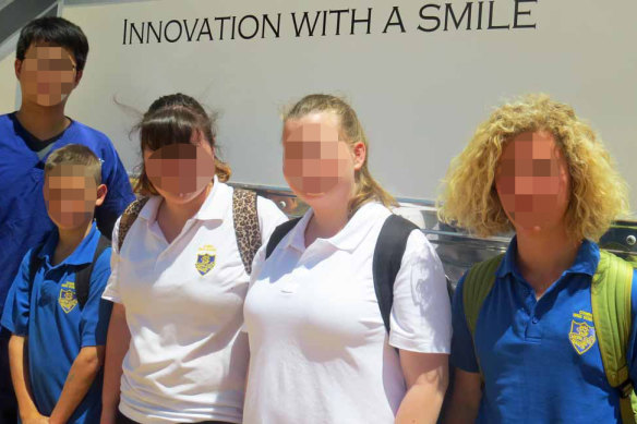 Children from Cowra High School pose for a photo after visiting the Smiles Onsite van in 2014. 