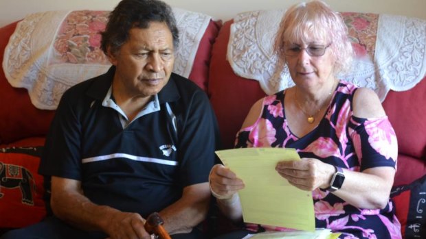 Reginald and Rosemarie Whiu reading their hospital discharge letters.