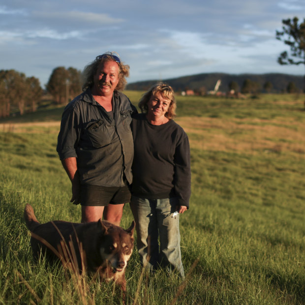 Brad and Gail Rayer, with their dog Wally, estimate they will lose $1 million from the bushfires.