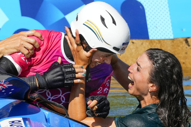 Jess Fox joins her sister Noemie celebrating a gold medal win in the kayak cross.