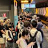 Commuters waiting at Chatswood station during the storm.