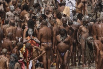 Naked Hindu holy men gather to take holy dips in the Ganges River during Kumbh Mela, or pitcher festival, in Haridwar, northern state of Uttarakhand, on April 12.