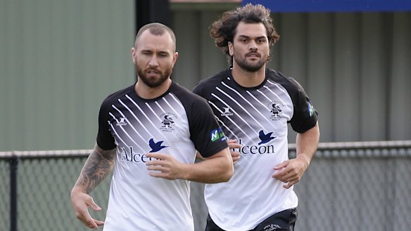 Cooper and fellow Reds exile Karmichael Hunt in a Brisbane club game for Souths last year. 