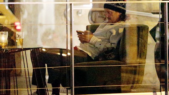 Chris Lilley attempts to fly under the radar by donning a beanie in Bondi.