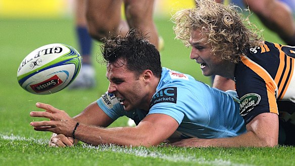 Making a game of it: Nick Phipps crosses for the home side at Bankwest Stadium, but it proved to be a mere consolation.