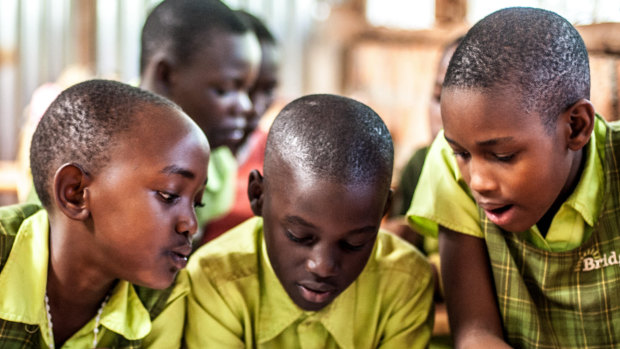 Students in class at a school in Uganda run by Bridge International.