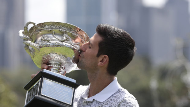 Novak Djokovic and the Australian Open trophy.