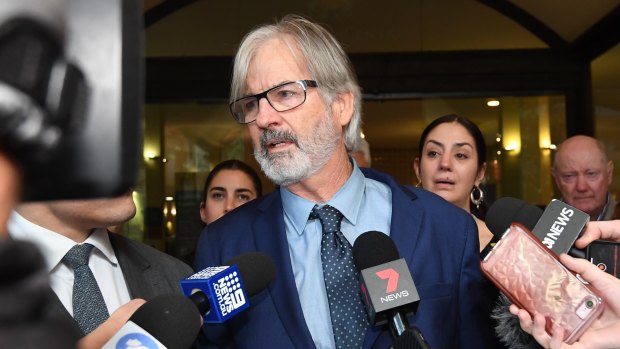 John Jarratt speaks to the waiting media pack after he was found not guilty.