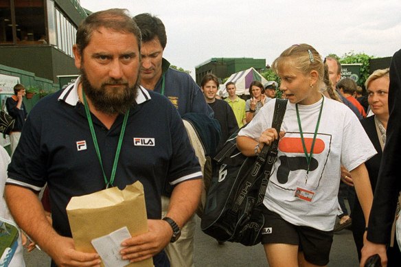 Australia’s Jelena Dokic walks through Wimbledon with her father, Damir.