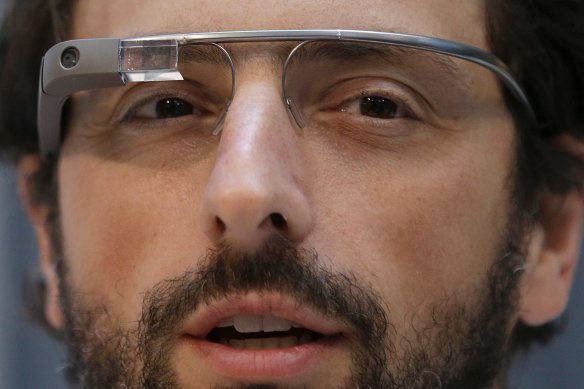 Google co-rounder Sergey Brin wears Google Glass glasses in 2013.