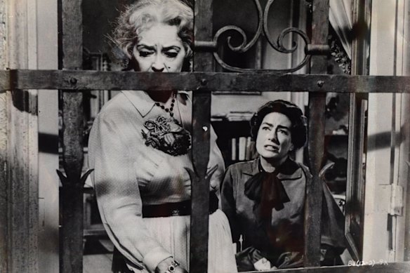 Crawford, right, with her co-star Bette Davis in <i>Whatever Happened to Baby Jane?</i>.