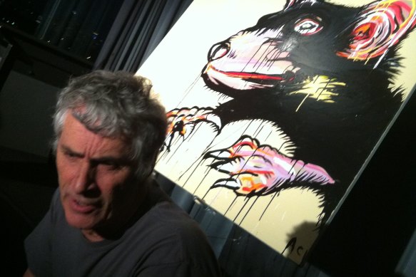 Paul Andrew with a Tassie devil painting by Adam Cullen.