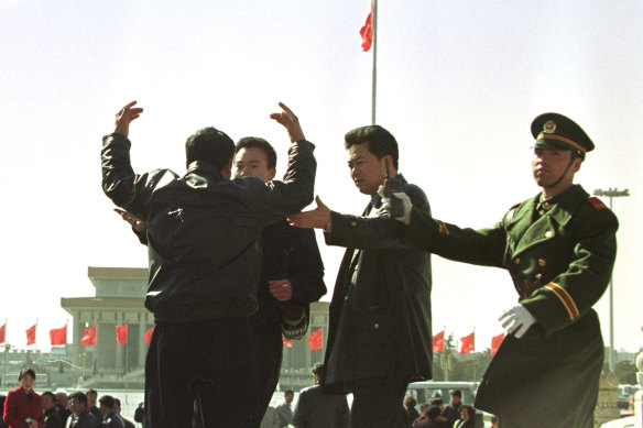 A Falun Gong member protests discrimination against the group in Beijing’s Tiananmen Square. 