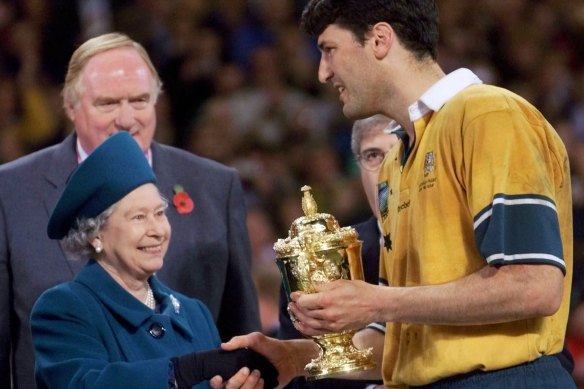Two-time Wallabies World Cup winner, John Eales, shakes hands with Queen Elizabeth II after winning the 1999 Cup.