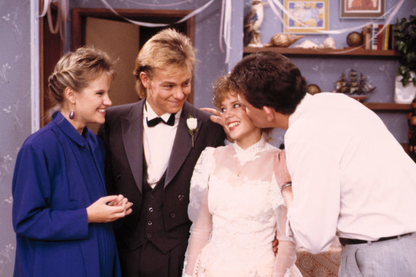 Daphne (Elaine Smith), Scott (Jason Donovan), Charlene (Kylie Minogue) and Des (Paul Keane) in Neighbours.