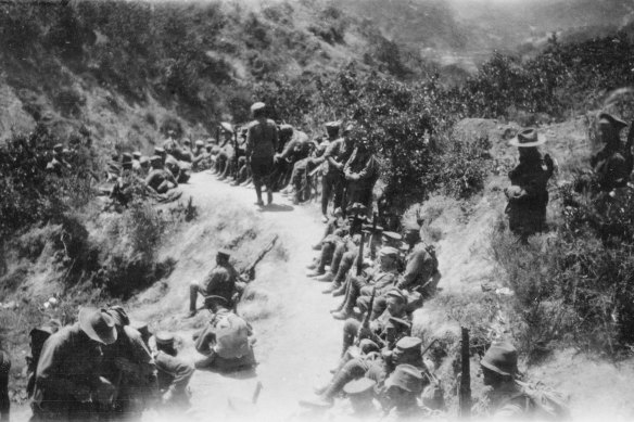 Australian troops rest in one of the gullies leading up to the front line. Photograph by Age correspondent Phillip Schuler. 