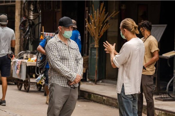 Showrunner Steve Lightfoot and leading man Charlie Hunnam discuss a scene on the set of Shantaram. 