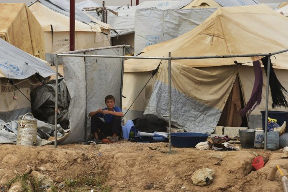 A young male sits outside a tent in the foreign annex in al-Hawl camp in north-east Syria last year.