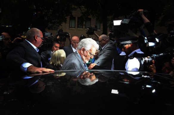 Rolf Harris leaves Southwark Crown Court in London during his 2014 trial.