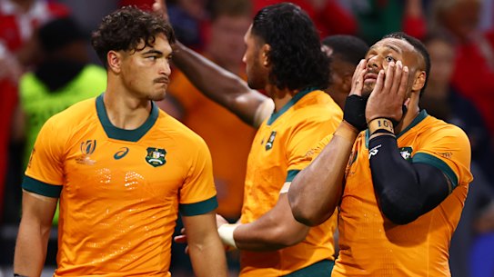 Dejection: Wallabies players after the record defeat to Wales.