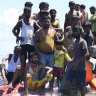 Rohingya refugees on a capsized boat before being rescued in the waters off West Aceh, Indonesia.