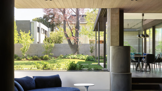 The sunken lounge is almost ‘buried’ into the garden.